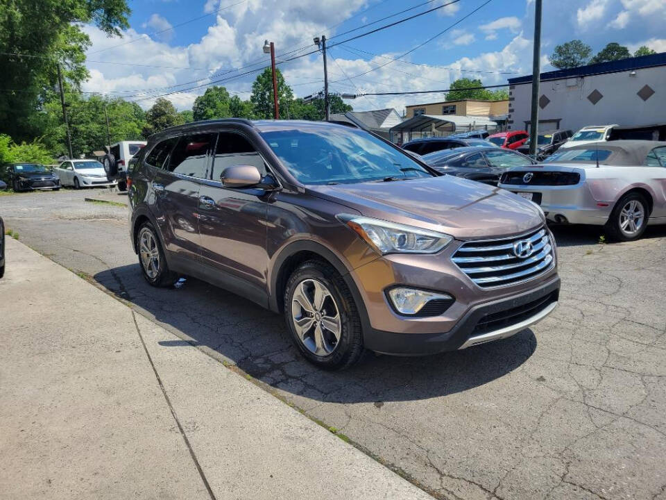 2015 Hyundai SANTA FE for sale at DAGO'S AUTO SALES LLC in Dalton, GA