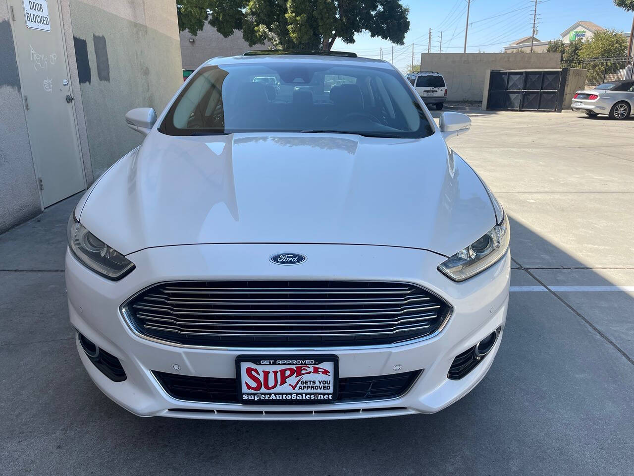 2014 Ford Fusion Hybrid for sale at Super Auto Sales Modesto in Modesto, CA