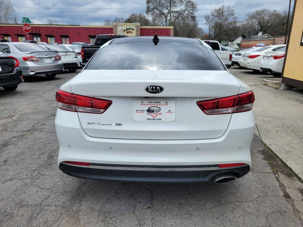 2016 Kia Optima for sale at DAGO'S AUTO SALES LLC in Dalton, GA