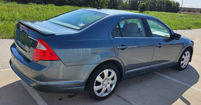 2011 Ford Fusion for sale at CAR MARKET AUTO GROUP in Sugar Land, TX