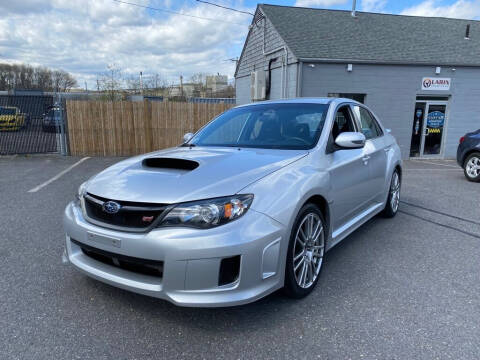 2011 Subaru Impreza for sale at LARIN AUTO in Norwood MA