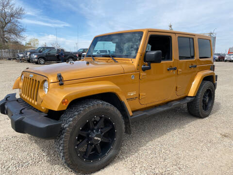2014 Jeep Wrangler Unlimited for sale at Truck Buyers in Magrath AB
