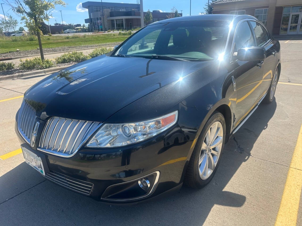 2011 Lincoln MKS for sale at JUST AUTOS in MINNEAPOLIS, MN