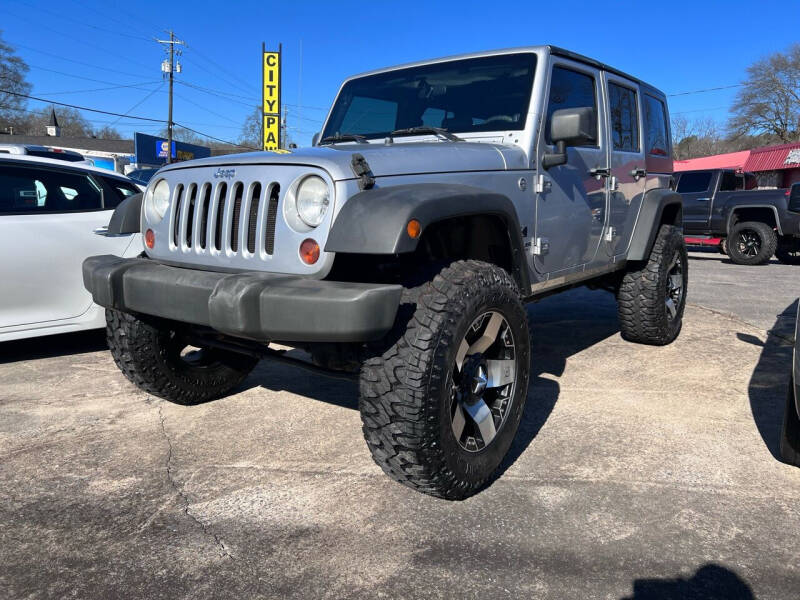 2009 Jeep Wrangler Unlimited for sale at DUNCAN AUTO SALES, INC in Cartersville GA