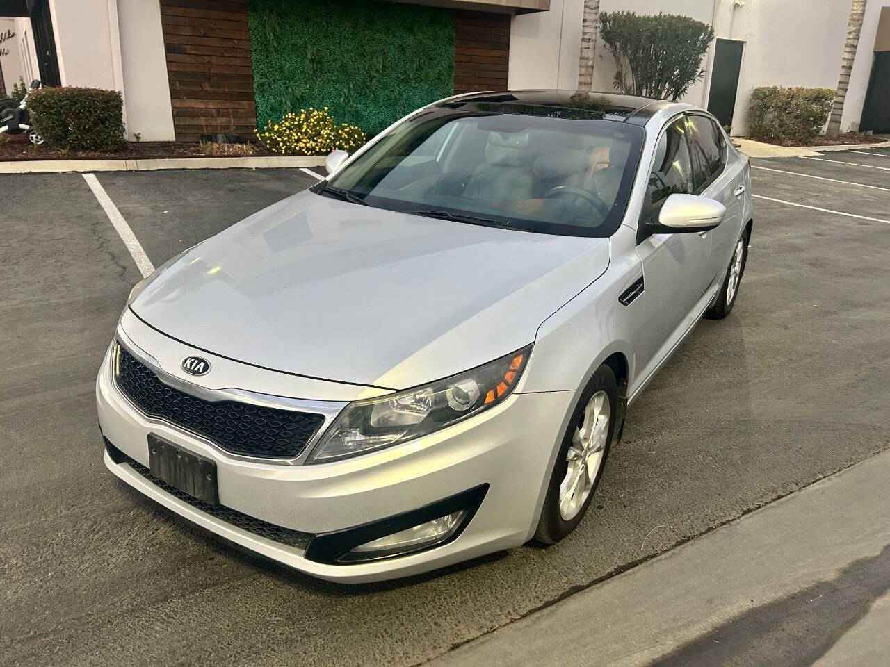 2013 Kia Optima for sale at STM AUTO GROUP LLC in Corona, CA