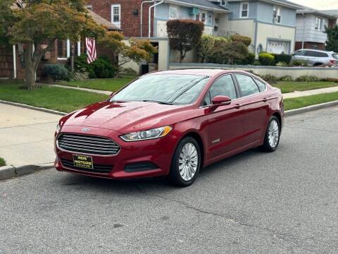 2015 Ford Fusion Hybrid for sale at Reis Motors LLC in Lawrence NY