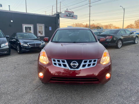 2013 Nissan Rogue for sale at Castle Cars Inc. in Lansing MI