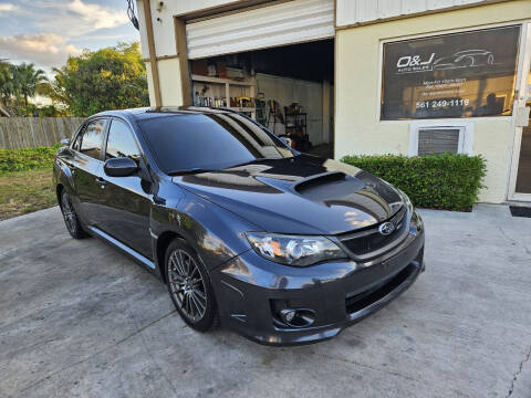 2011 Subaru Impreza for sale at O & J Auto Sales in Royal Palm Beach FL