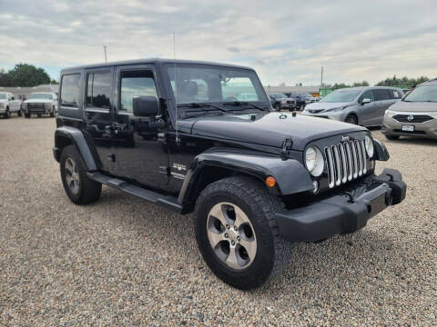 2016 Jeep Wrangler Unlimited for sale at BERKENKOTTER MOTORS in Brighton CO