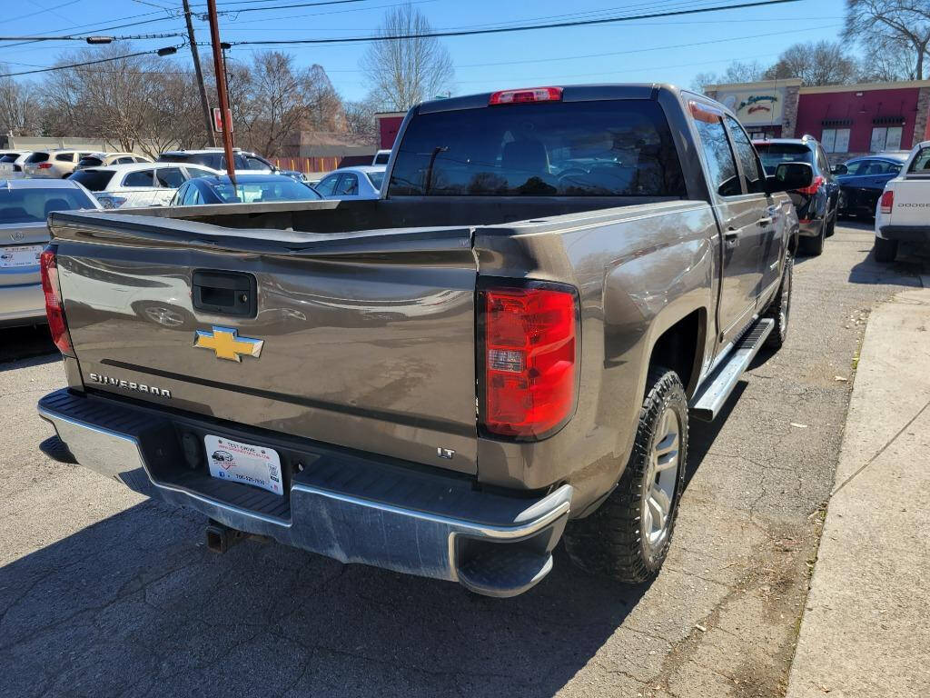 2014 Chevrolet Silverado 1500 for sale at DAGO'S AUTO SALES LLC in Dalton, GA