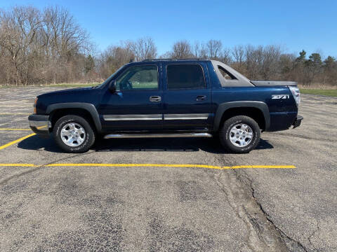 2006 Chevrolet Avalanche for sale at Caruzin Motors in Flint MI