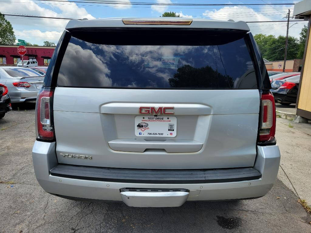 2016 GMC Yukon for sale at DAGO'S AUTO SALES LLC in Dalton, GA