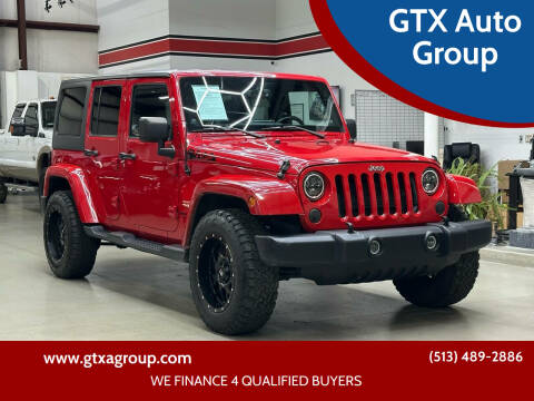 2013 Jeep Wrangler Unlimited for sale at GTX Auto Group in West Chester OH