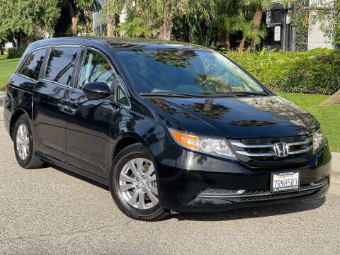 2016 Honda Odyssey for sale at MILLENNIUM MOTORS in Van Nuys CA