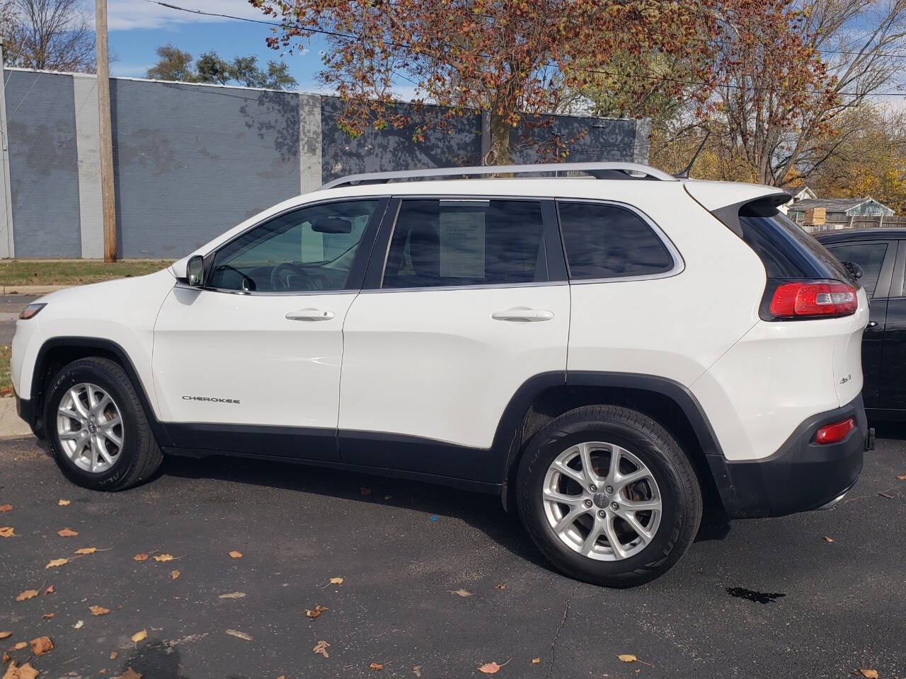 2015 Jeep Cherokee for sale at Auto Shop in Wyoming, MI