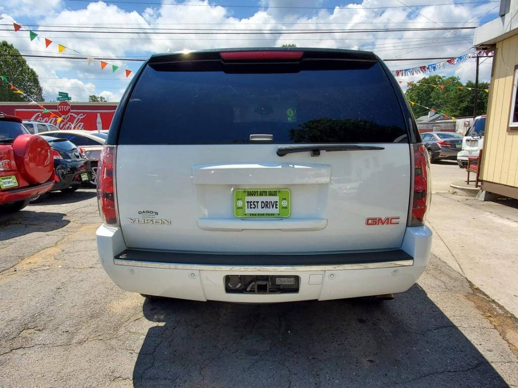 2007 GMC Yukon for sale at DAGO'S AUTO SALES LLC in Dalton, GA