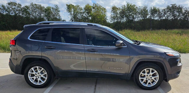 2017 Jeep Cherokee for sale at CAR MARKET AUTO GROUP in Sugar Land, TX