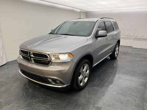 2014 Dodge Durango for sale at Roman's Auto Sales in Warren MI