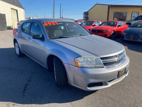 2014 Dodge Avenger for sale at BELOW BOOK AUTO SALES in Idaho Falls ID