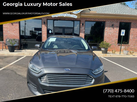 2014 Ford Fusion for sale at Georgia Luxury Motor Sales in Cumming GA