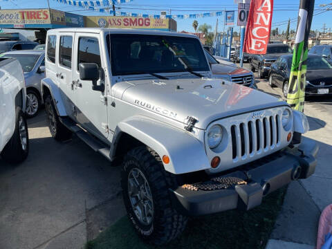 2012 Jeep Wrangler Unlimited for sale at ROMO'S AUTO SALES in Los Angeles CA