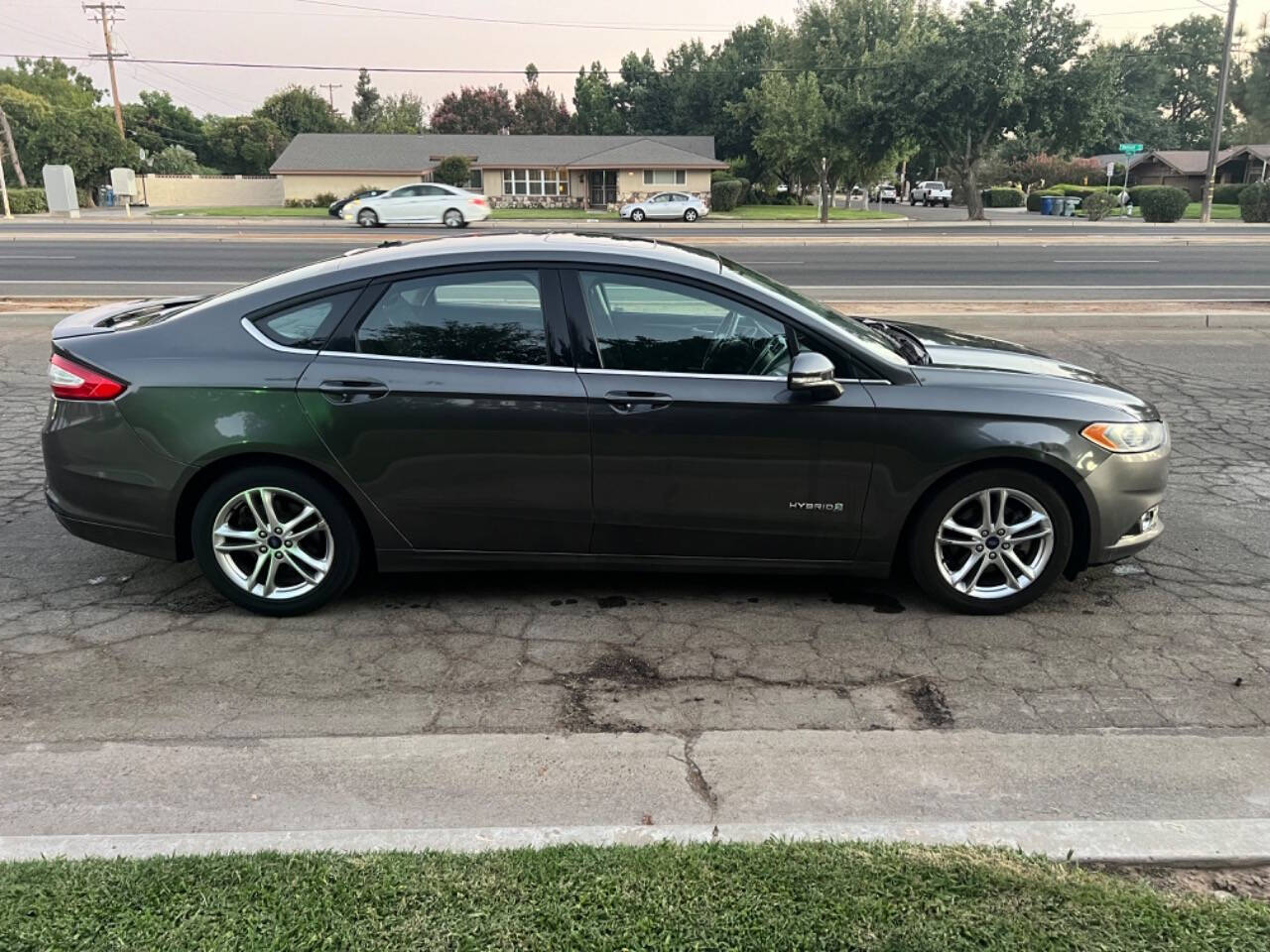 2016 Ford Fusion Hybrid for sale at AUTO 4 LESS in Fresno, CA