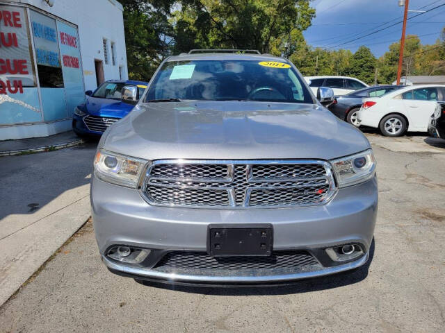 2014 Dodge Durango for sale at DAGO'S AUTO SALES LLC in Dalton, GA