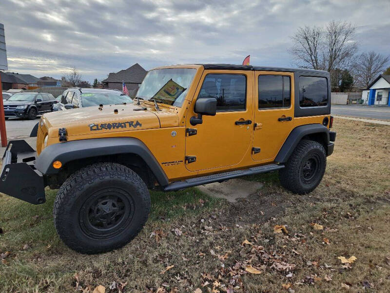 2014 Jeep Wrangler Unlimited for sale at CarTime in Rogers AR