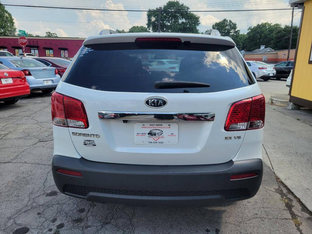 2011 Kia Sorento for sale at DAGO'S AUTO SALES LLC in Dalton, GA