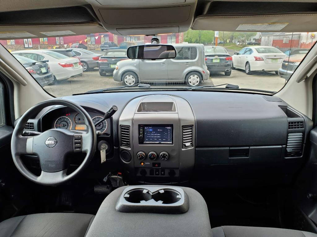 2011 Nissan Titan for sale at DAGO'S AUTO SALES LLC in Dalton, GA