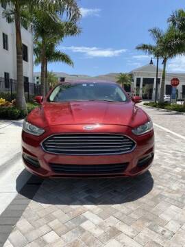 2013 Ford Fusion for sale at McIntosh AUTO GROUP in Fort Lauderdale FL