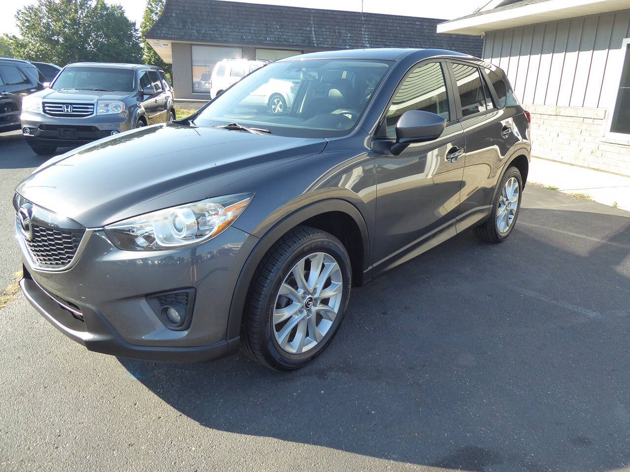 2014 Mazda CX-5 for sale at Lakeshore Autos in Holland, MI