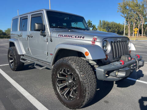 2013 Jeep Wrangler Unlimited for sale at Nation Autos Miami in Hialeah FL