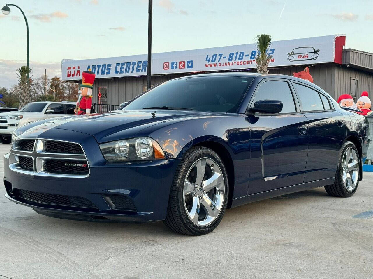 2014 Dodge Charger for sale at DJA Autos Center in Orlando, FL