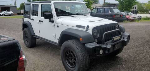 2016 Jeep Wrangler Unlimited for sale at Village Car Company in Hinesburg VT
