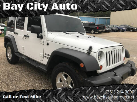 2013 Jeep Wrangler Unlimited for sale at Bay City Auto's in Mobile AL
