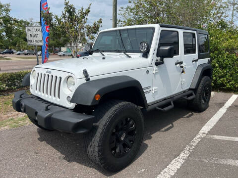 2014 Jeep Wrangler Unlimited for sale at Bay City Autosales in Tampa FL