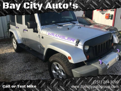 2009 Jeep Wrangler Unlimited for sale at Bay City Auto's in Mobile AL