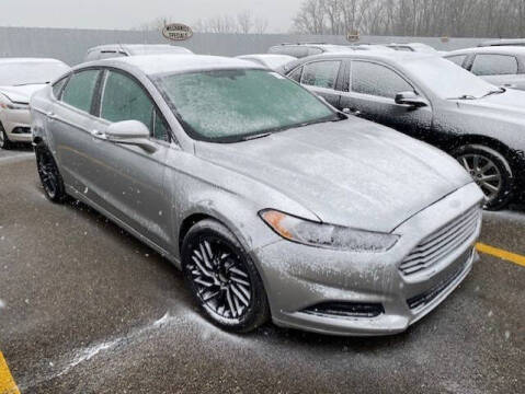 2014 Ford Fusion for sale at WELLER BUDGET LOT in Grand Rapids MI