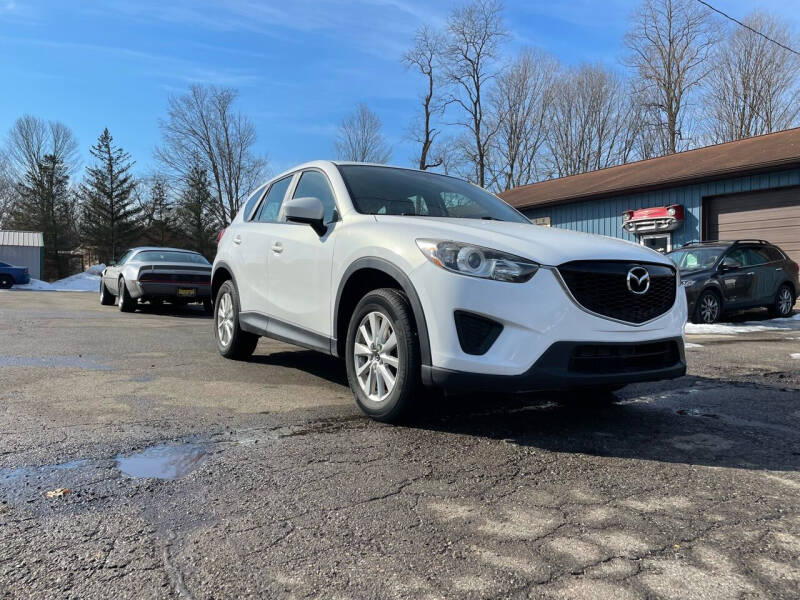 2013 Mazda CX-5 for sale at Rombaugh's Auto Sales in Battle Creek MI
