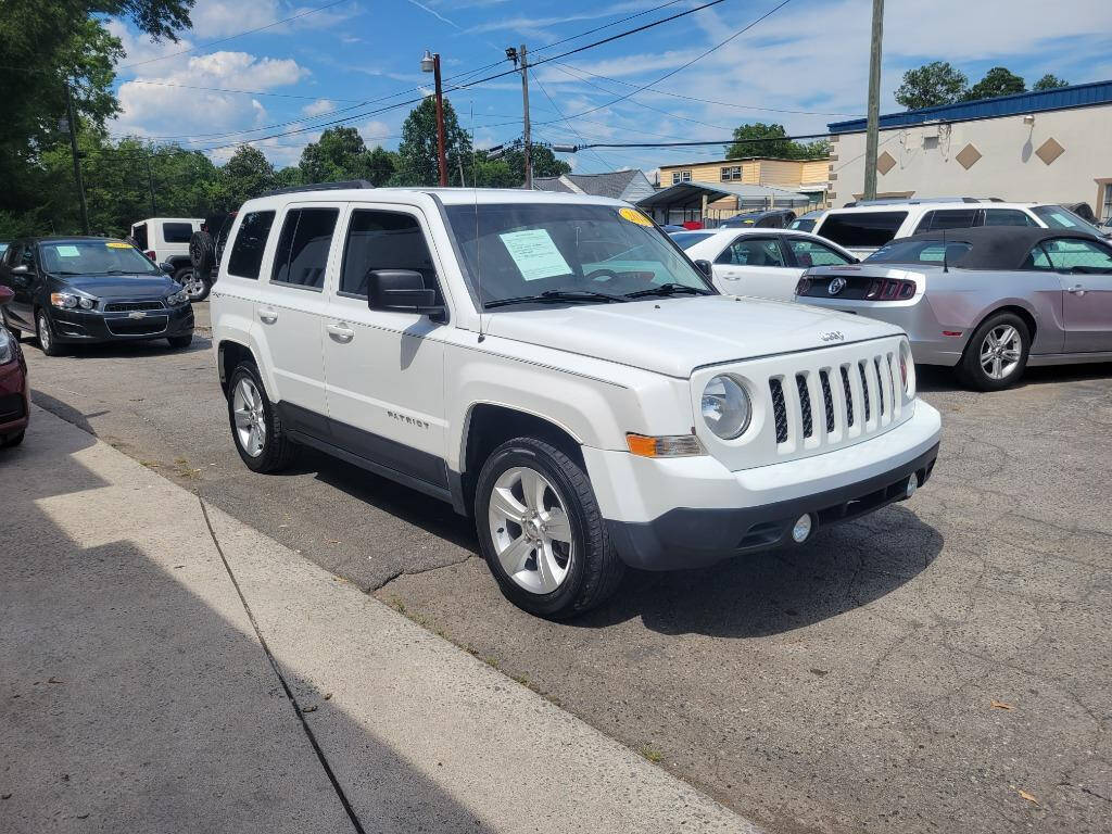 2014 Jeep Patriot for sale at DAGO'S AUTO SALES LLC in Dalton, GA