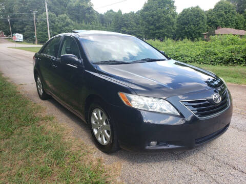 2009 Toyota Camry for sale at GEORGIA AUTO DEALER LLC in Buford GA