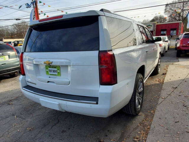 2015 Chevrolet Suburban for sale at DAGO'S AUTO SALES LLC in Dalton, GA