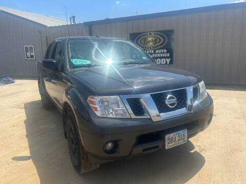 2013 Nissan Frontier for sale at BERG AUTO MALL & TRUCKING INC in Beresford SD