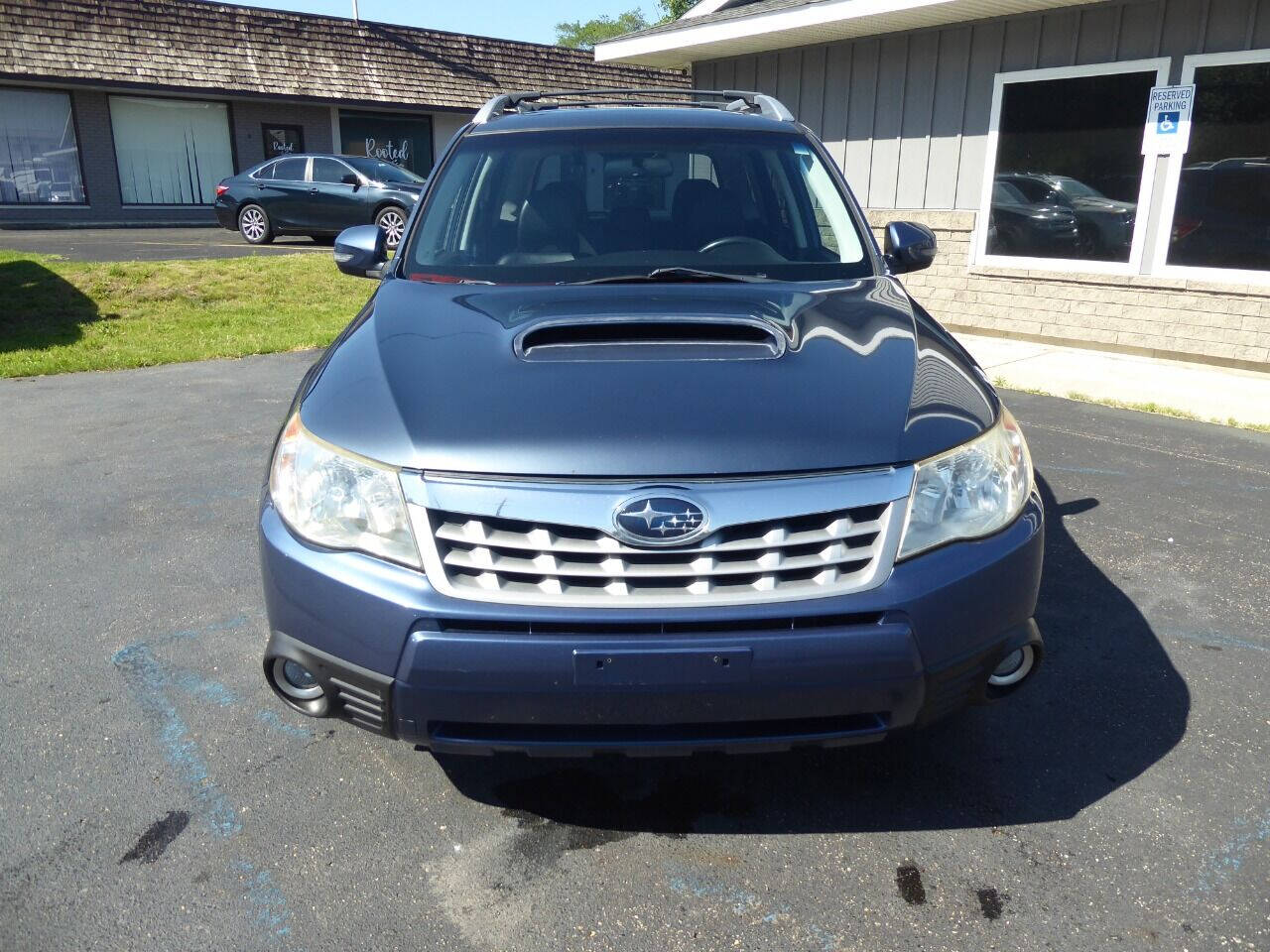 2011 Subaru Forester for sale at Lakeshore Autos in Holland, MI