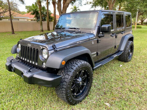 2018 Jeep Wrangler JK Unlimited for sale at DENMARK AUTO BROKERS in Riviera Beach FL