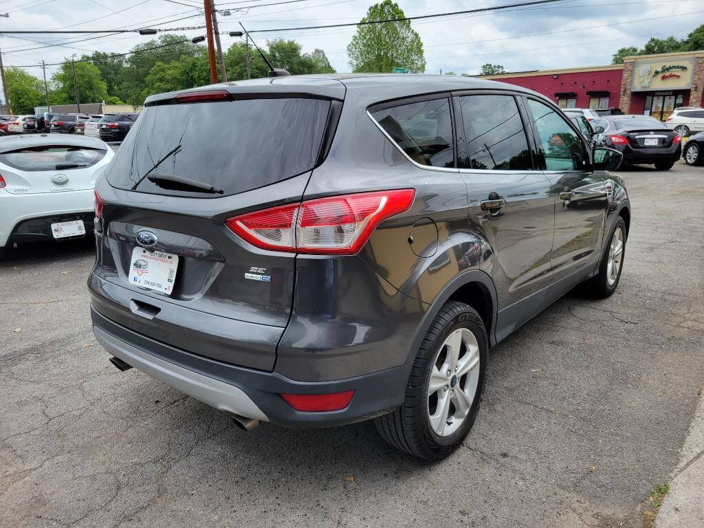 2015 Ford Escape for sale at DAGO'S AUTO SALES LLC in Dalton, GA