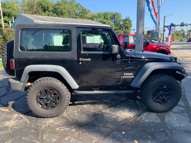 2014 Jeep Wrangler for sale at Chuckie Bizzarro's Fleetwing Auto in Erie, PA