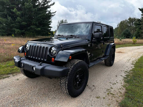 2012 Jeep Wrangler Unlimited for sale at Hammer Auto LLC in Stanwood MI