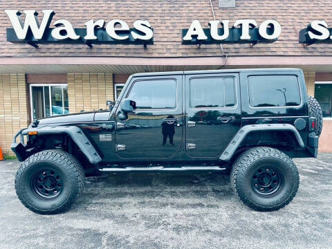 2013 Jeep Wrangler Unlimited for sale at Wares Auto Sales INC in Traverse City MI